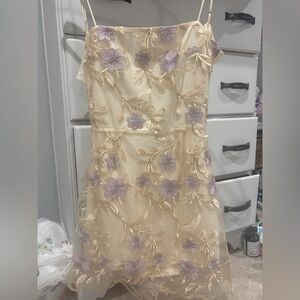 Lucy in the Sky purple and gold mini dress with flowers.